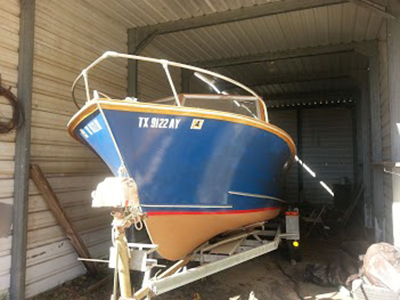 Thisboat is a 20 ft. long all wood vessel that is designed to be used 