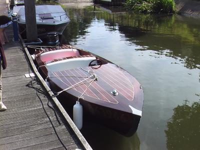Side by side, a mahogany runabout