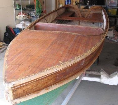 repair fiberglass over wood scow warped keel?