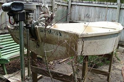 Small vintage wooden dinghy made in 2 parts.